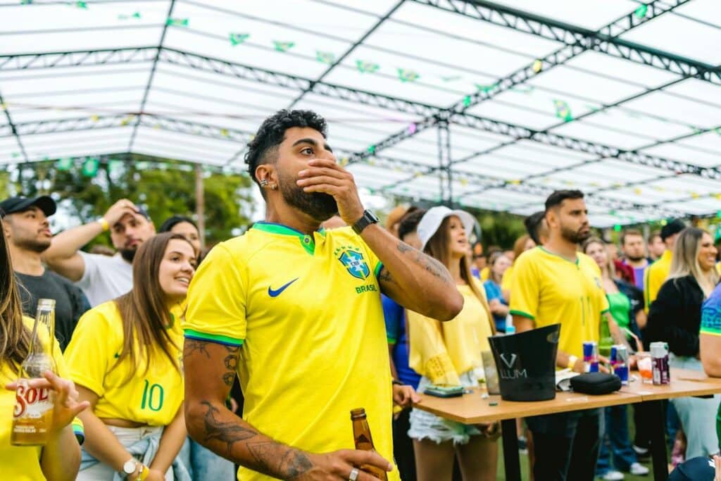 Football fans watching a match together in an outdoor fan zone