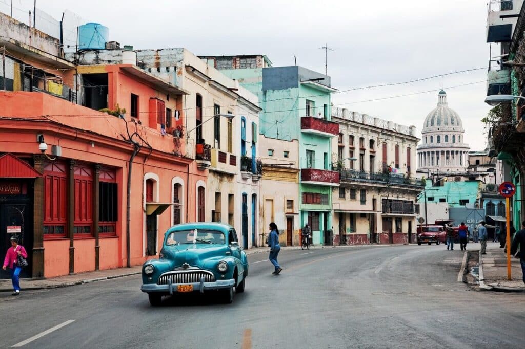 Calle Ocho street in Little Havana Miami with colorful buildings and classic car