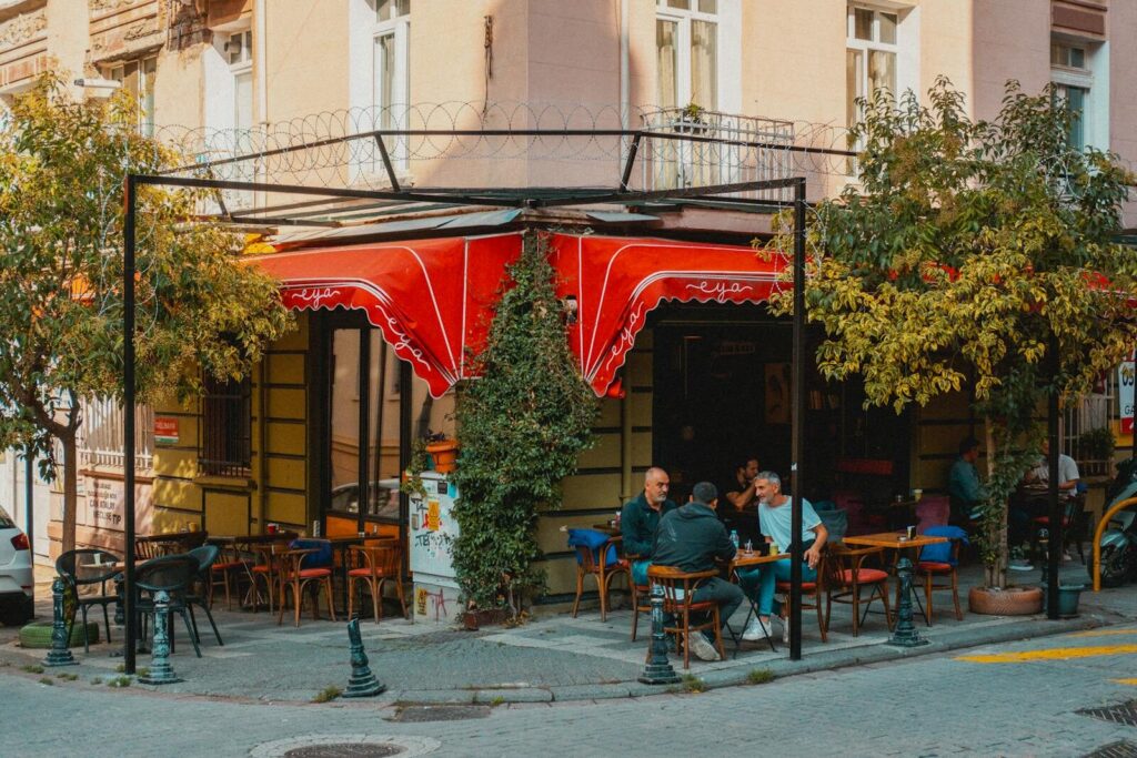 Top Things to Do in Dallas During the World Cup 2026 11 People sitting at an outdoor café in Bishop Arts District Dallas with a red awning and relaxed atmosphere