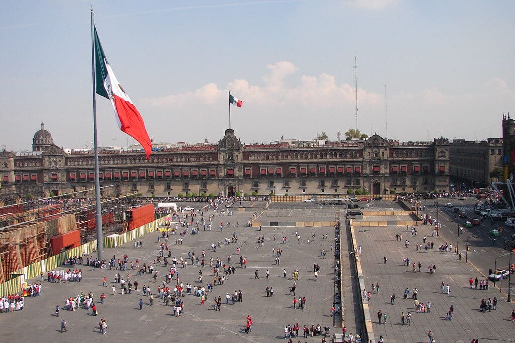 Zócalo main square with Mexican flag and historic buildings