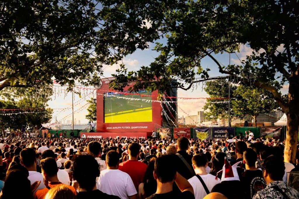 Top Things to Do in New York City During the World Cup 2026 5 Large crowd watching a football match on a giant screen at an outdoor fan festival