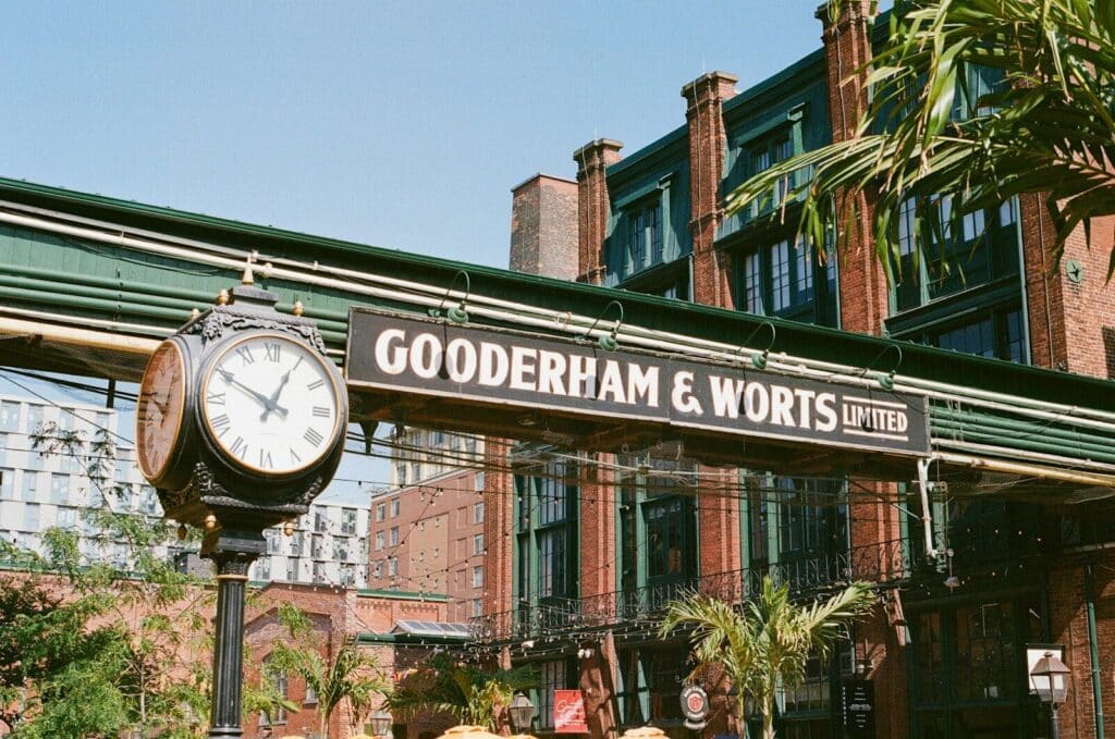 Gooderham and Worts sign in Toronto’s Distillery District with historic brick buildings and industrial architecture