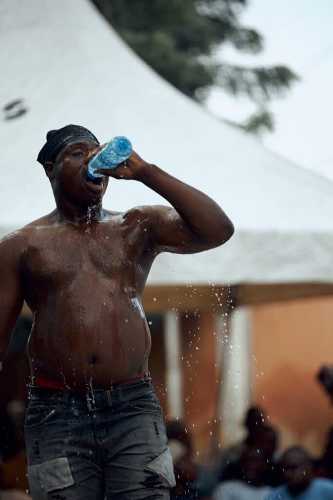 World Cup 2026 Travel Tips: What Most Guides Won't Tell You 9 Person cooling down and drinking water in extreme heat conditions