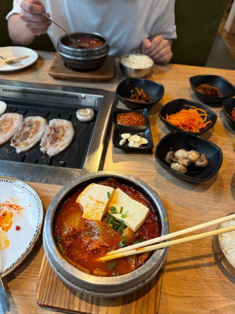 Korean BBQ meal with multiple side dishes in Los Angeles