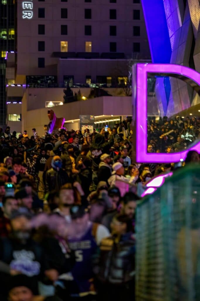 Top Things to Do in Dallas During the World Cup 2026 19 Crowd watching a large outdoor screen in a downtown Dallas-style plaza during a night event