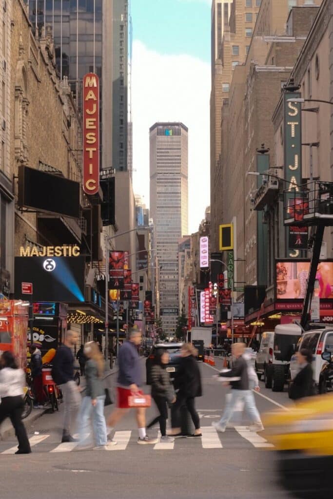 Top Things to Do in New York City During the World Cup 2026 16 Busy New York street with pedestrians crossing and city traffic in motion