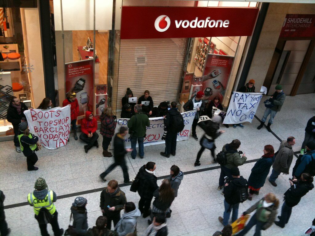 Vodafone store with people buying SIM cards in a shopping mall