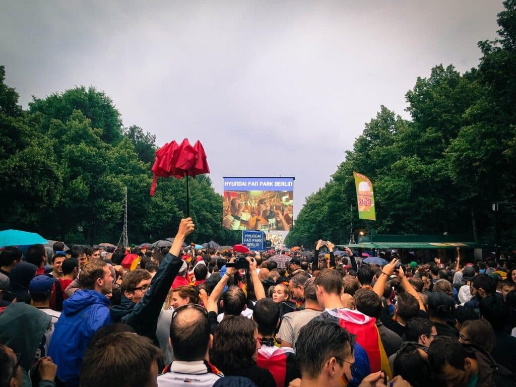 Crowd watching a live football match on a big screen at a fan festival in Toronto — Top Things to Do in Toronto During the World Cup 2026
