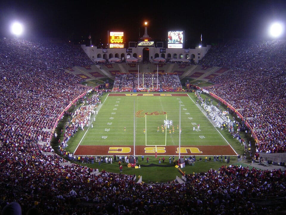 LA Memorial Coliseum filled with spectators during a major football match in Los Angeles