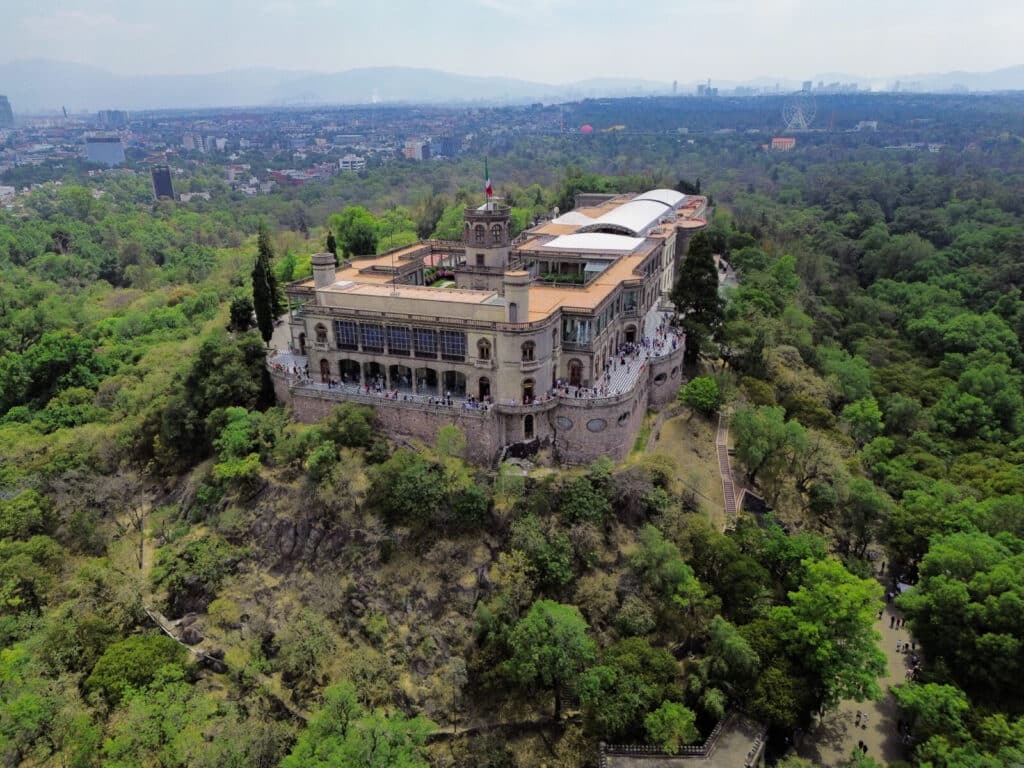 Chapultepec Castle surrounded by green parkland in Mexico City with views over the city