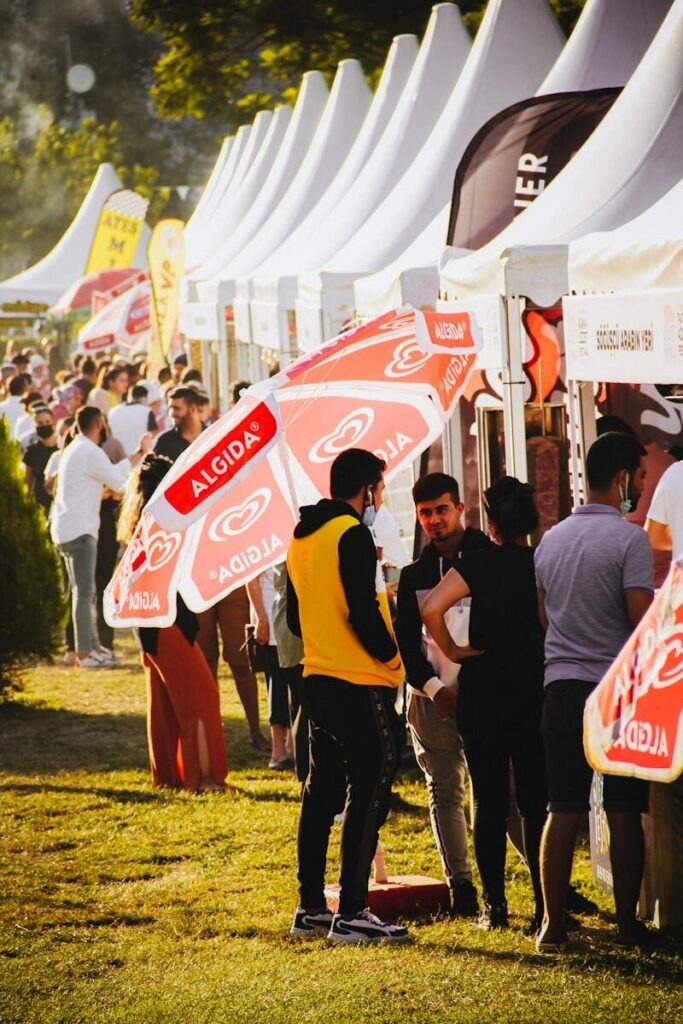Outdoor food stalls and visitors at a fan festival food market — World Cup 2026 Fan Zones Guide atmosphere