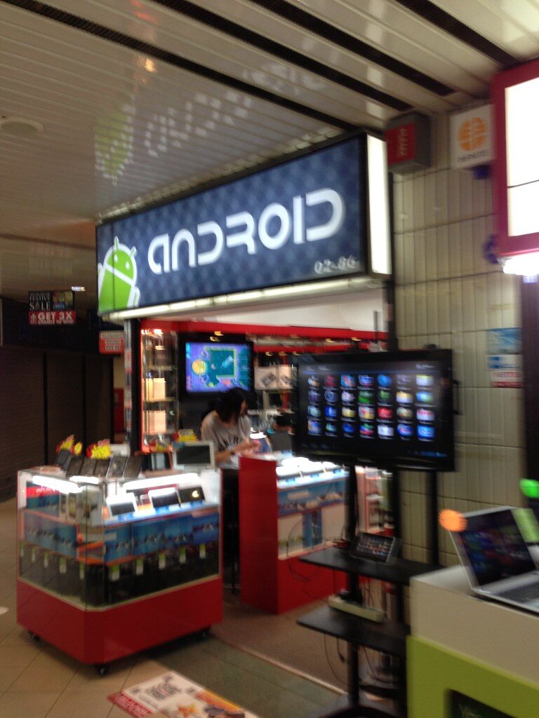 Mobile phone shop kiosk selling SIM cards in a transport hub
