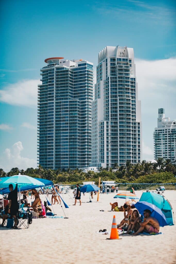 Sunny beach scene in Miami with people and umbrellas during the World Cup 2026 