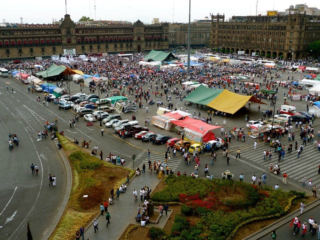 Crowds gathering at Zócalo square in Mexico City during a large public event