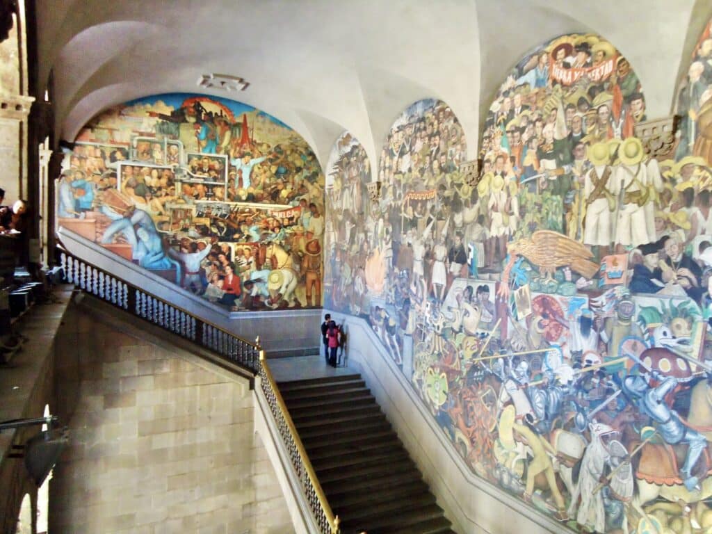 Diego Rivera murals inside Palacio Nacional in Mexico City showing scenes from Mexican history