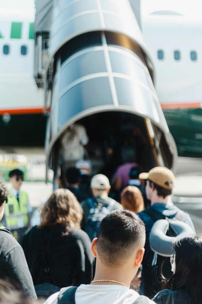FIFA World Cup 2026 Travel Checklist Stress‑Free Prep: Everything to Do Before You Go 13 Passengers boarding airplane for international travel between World Cup 2026 host countries