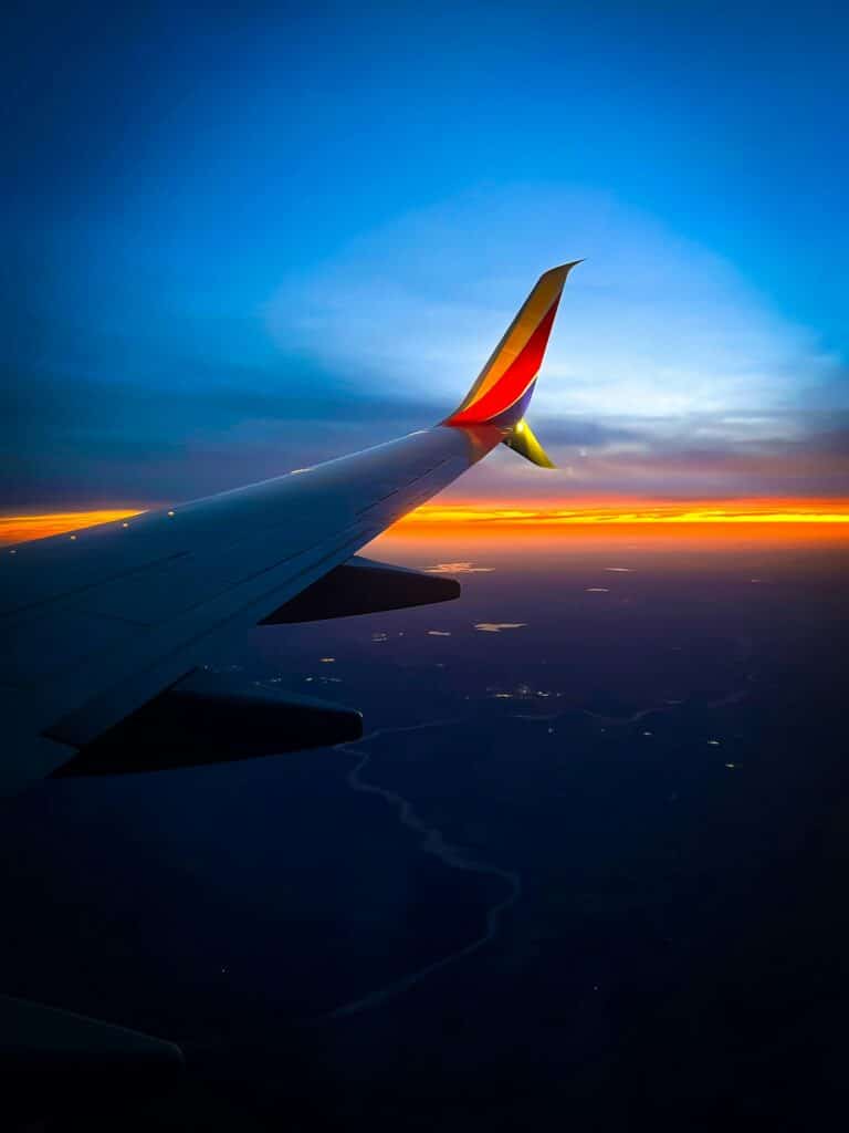 FIFA World Cup 2026 Travel Checklist Stress‑Free Prep: Everything to Do Before You Go 14 Airplane wing view during international flight across countries at sunset