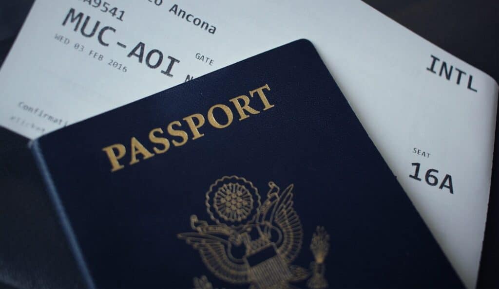 How to Plan a Last-Minute World Cup 2026 Trip (8-Week Countdown) 5 US passport placed on top of a boarding pass ready for international travel