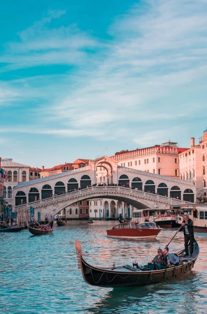 Gondola on canal near Rialto Bridge in Venice Italy