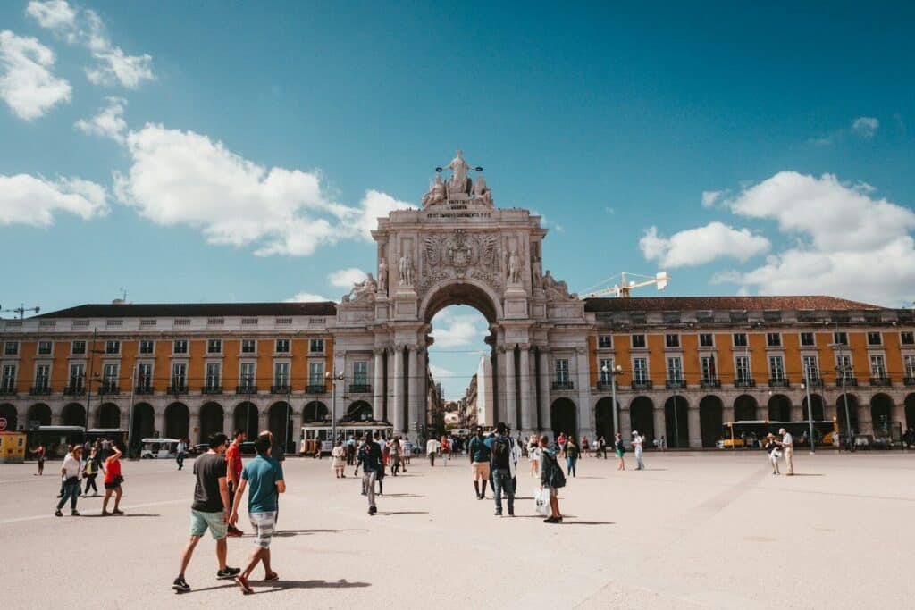eSIM Portugal vs Roaming: Best Way to Stay Connected as a Traveler in 2026 6 people gathered on street