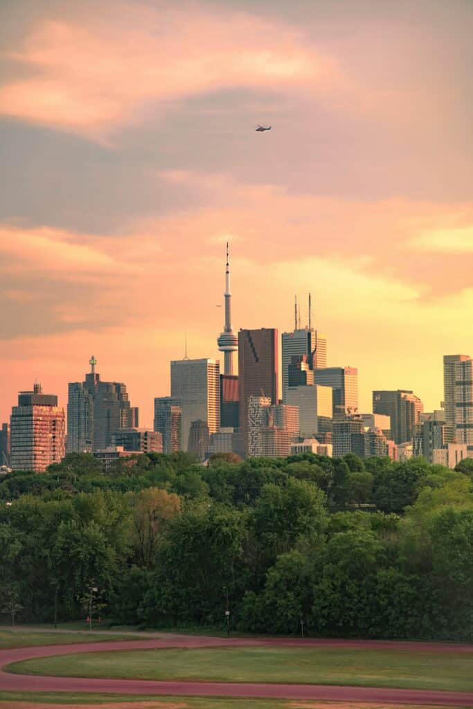 Toronto skyline at sunset with CN Tower, representing travel between World Cup host cities