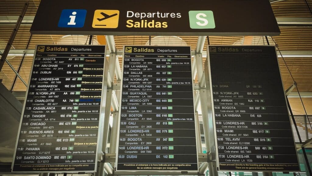 How to Plan a Last-Minute World Cup 2026 Trip (8-Week Countdown) 3 Airport departures board showing multiple international flights for travel planning