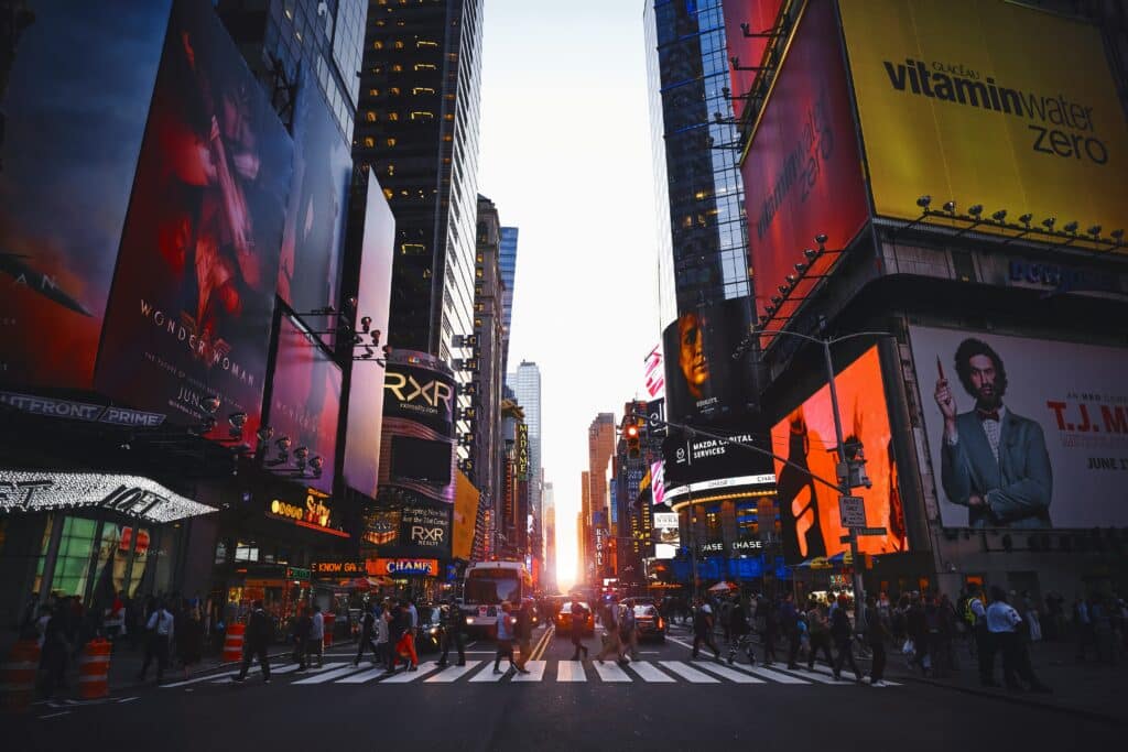 Uber vs Public Transport for World Cup 2026? Avoid Surge Pricing and Overpriced Stadium Trains 7 Busy street scene in New York City with pedestrians and traffic, illustrating how Uber vs Public Transport at the World Cup 2026 plays out in well-connected cities