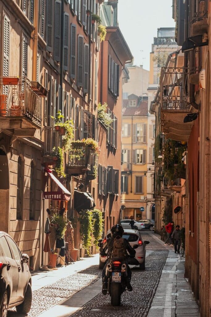 Narrow street in Florence with buildings and scooter