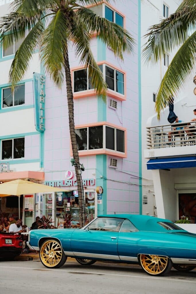 Colorful Art Deco buildings and classic car on Ocean Drive in South Beach Miami