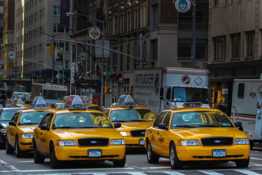 Top Things to Do in New York City During the World Cup 2026 20 Yellow taxis driving through a busy street in New York City