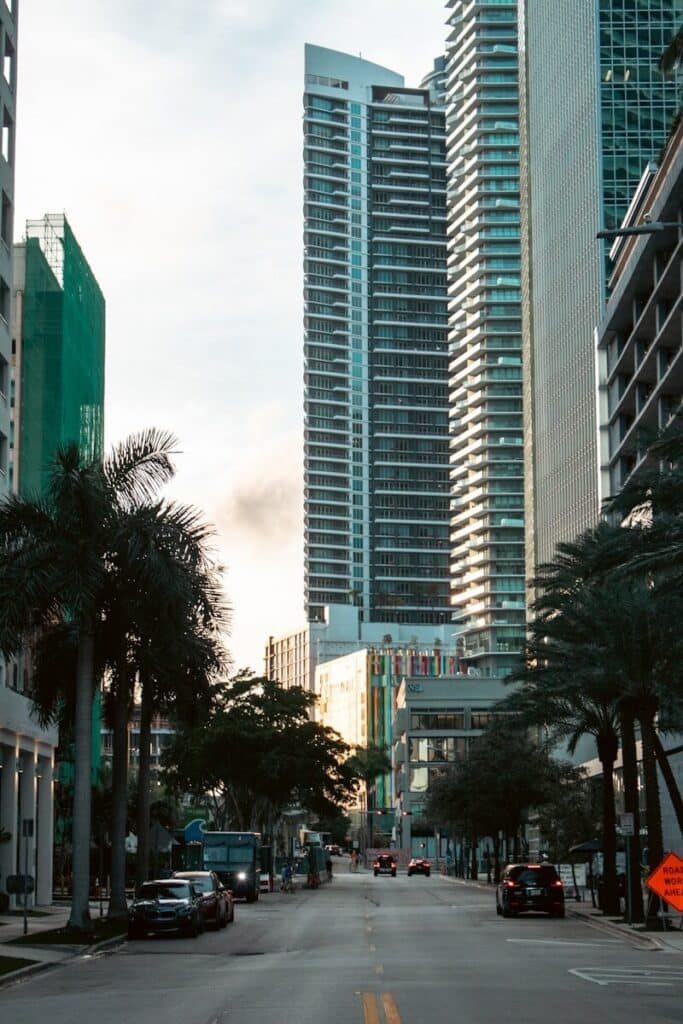 Street view of Brickell Miami with modern high-rise buildings and palm trees