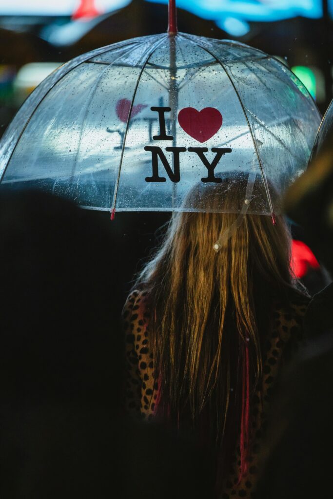 World Cup 2026 Weather Explained: What to Expect in All 16 Host Cities 8 Person holding umbrella in New York rain during the World Cup 2026 weather conditions