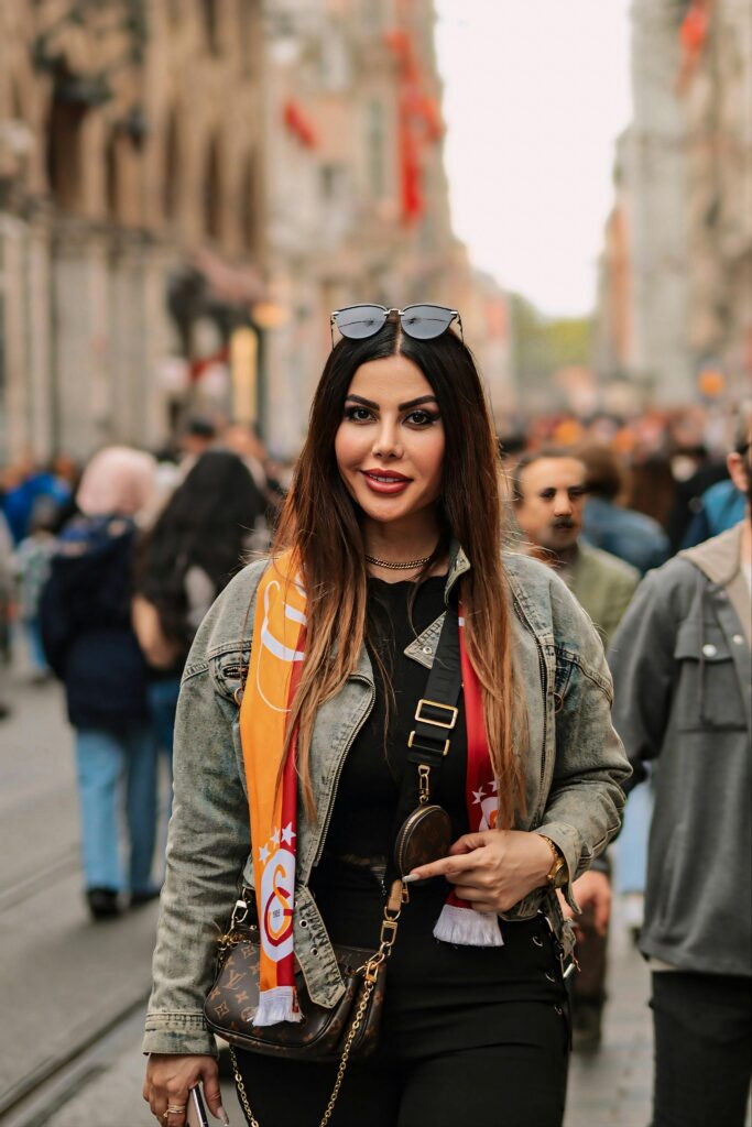 Fan wearing a jacket in a city street, showing what to pack for the World Cup 2026 in cooler Pacific host cities