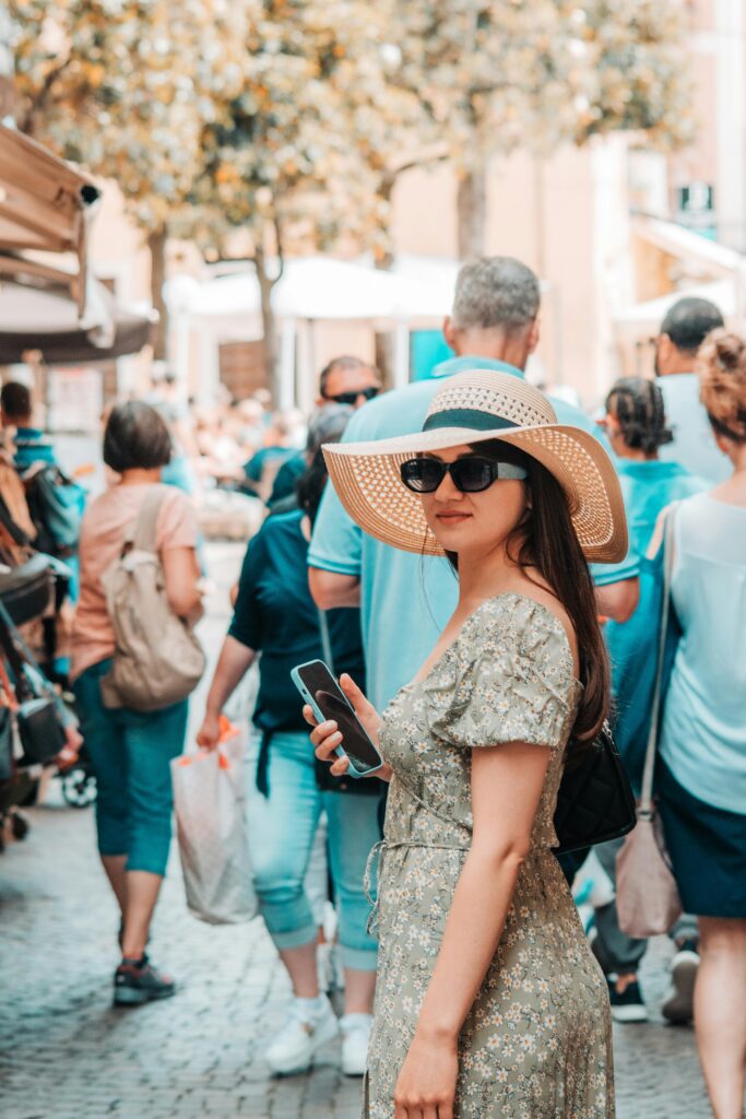 Tourist walking through a crowded street in hot weather, showing what to pack for the World Cup 2026 in high temperatures