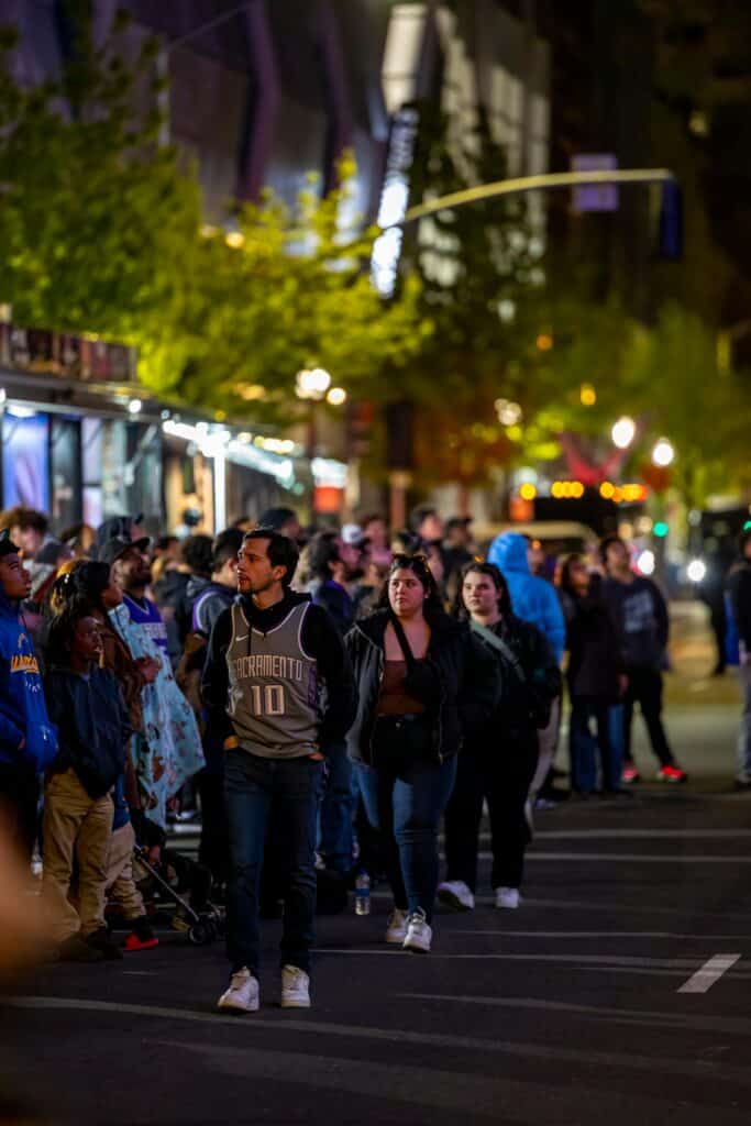 How Busy Will the World Cup 2026 Host Cities Be? (What to Expect) 3 People standing in long lines on a city street at night during a major event