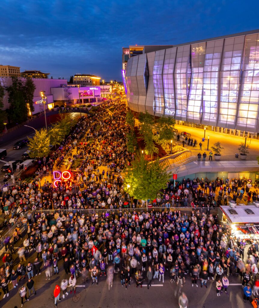 massive crowd leaving stadium after match with thousands of fans at night
