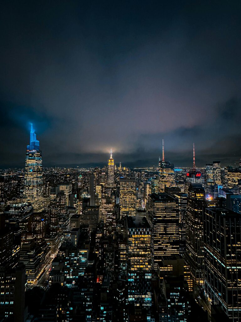 New York City skyline at night with illuminated skyscrapers during a World Cup trip