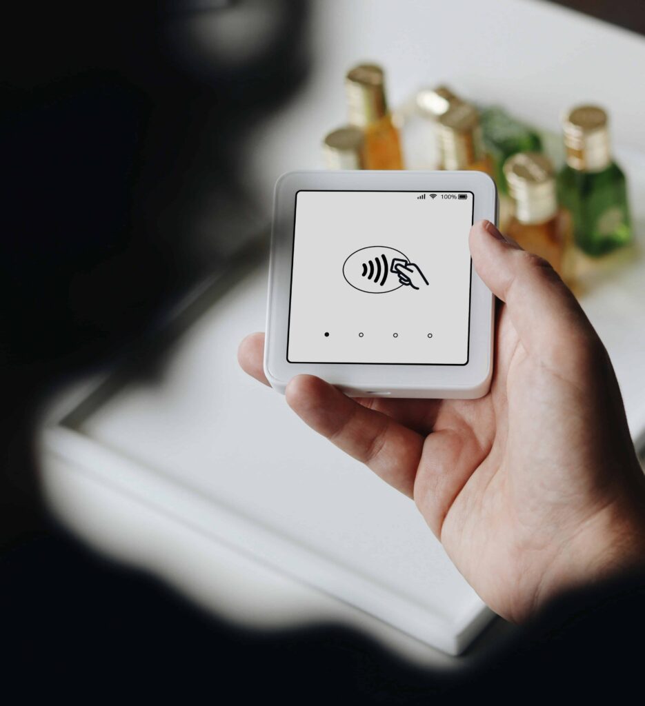 Hand holding a portable mobile hotspot device used for internet access while travelling abroad