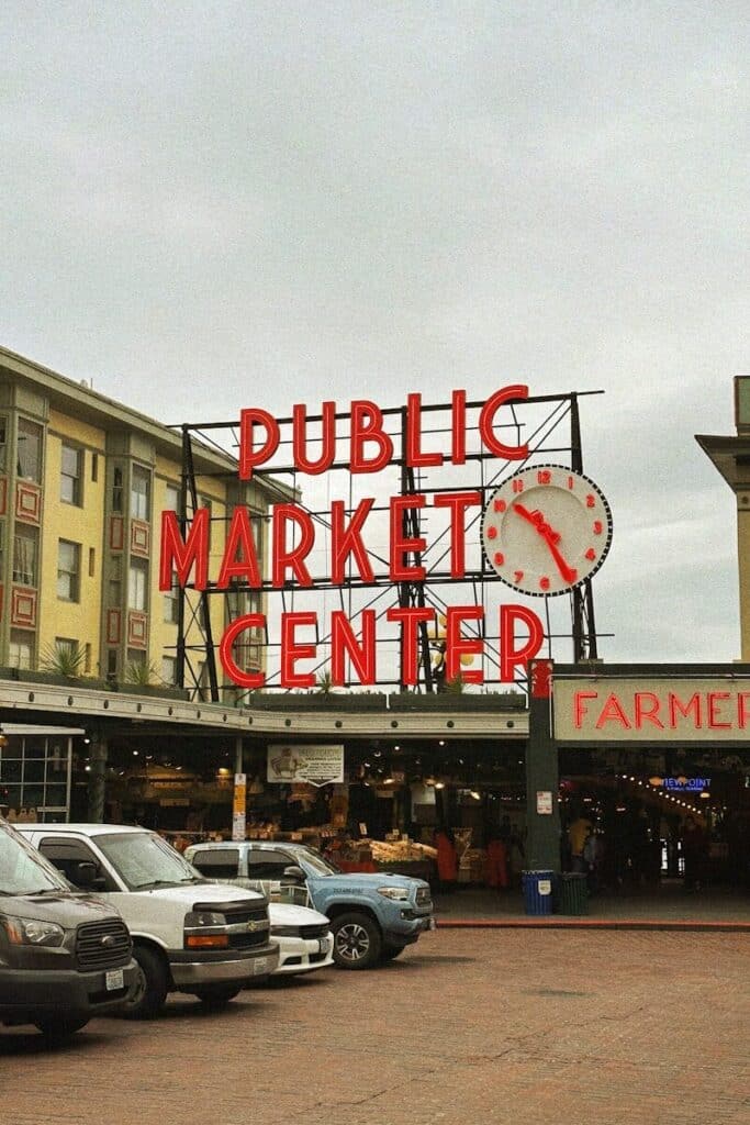 Pike Place Market entrance sign with crowds in Seattle