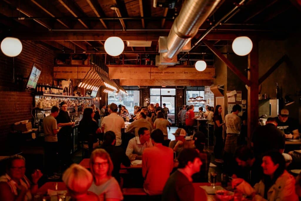 World Cup 2026 Travel Tips: What Most Guides Won't Tell You 10 Busy restaurant filled with people during evening dining hours