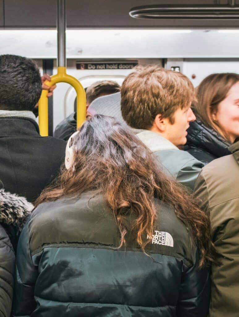 Uber vs Public Transport for World Cup 2026? Avoid Surge Pricing and Overpriced Stadium Trains 5 Crowded metro train after a major event with passengers packed together during peak travel time