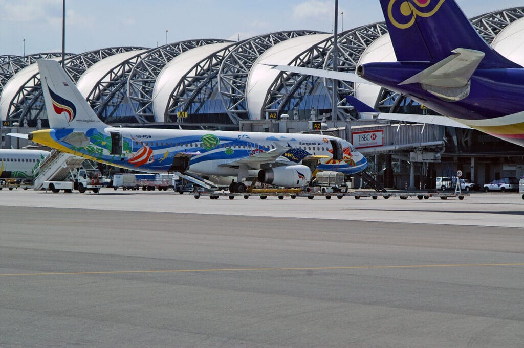 Bangkok Suvarnabhumi Airport apron with Bangkok Air and Thai Airways planes at the gates