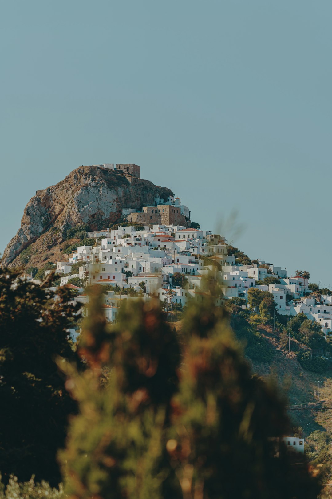 Alternatives to Santorini: Less Crowded Greek Islands Worth Visiting 18 Building perched on a mountaintop overlooking the Greek coastline
