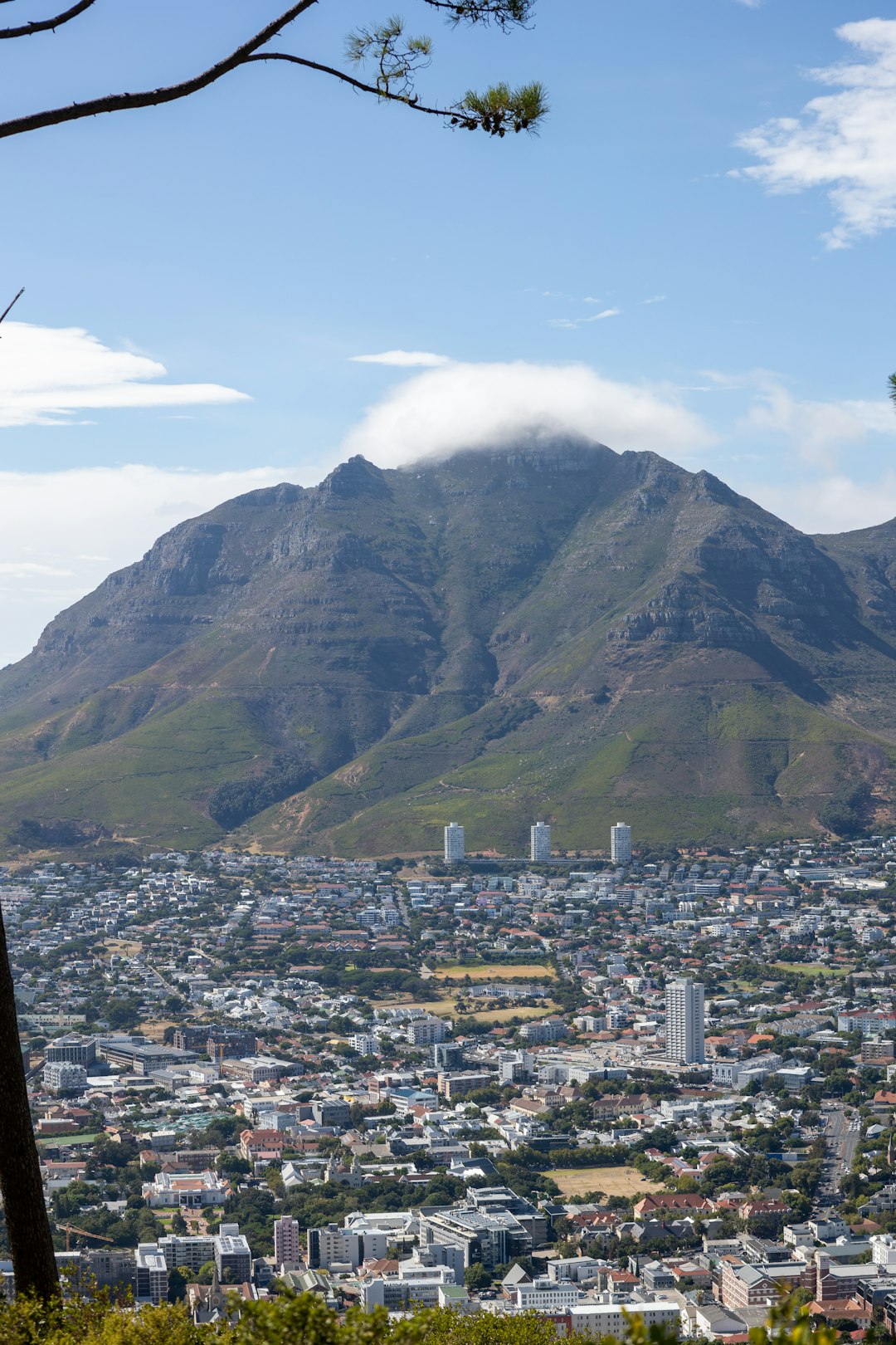 sprawling cityscape sitting below a large mountain peak in South Africa