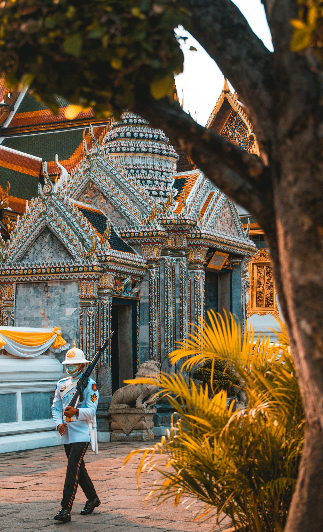 Man standing near a concrete building in Thailand during the day