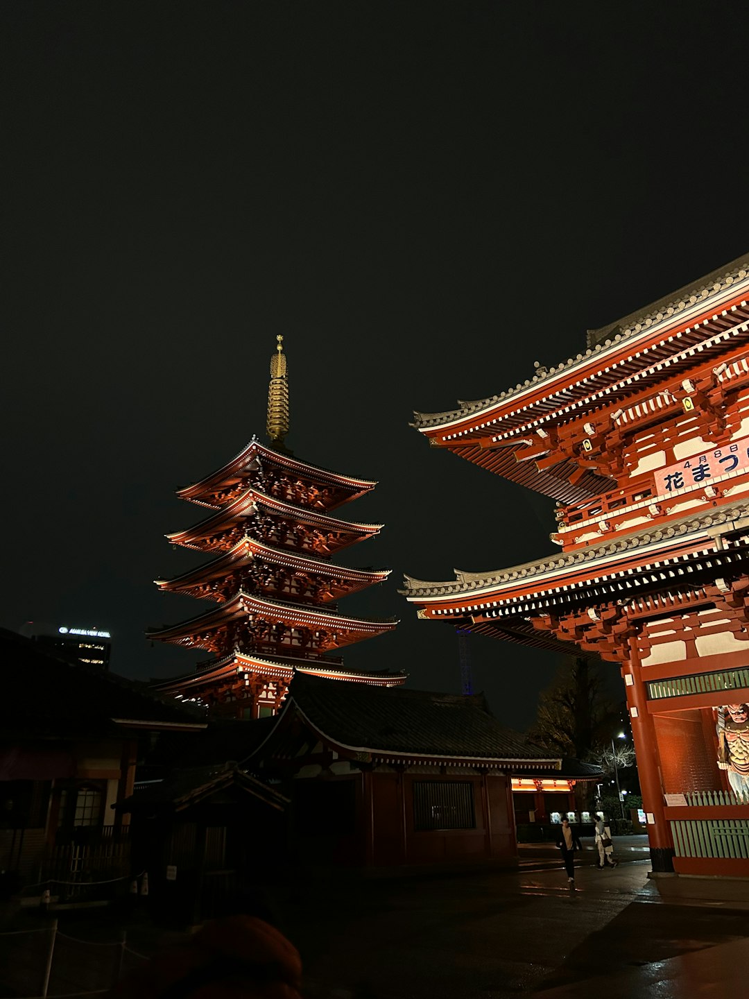 Tall Tokyo building set against a dark evening sky