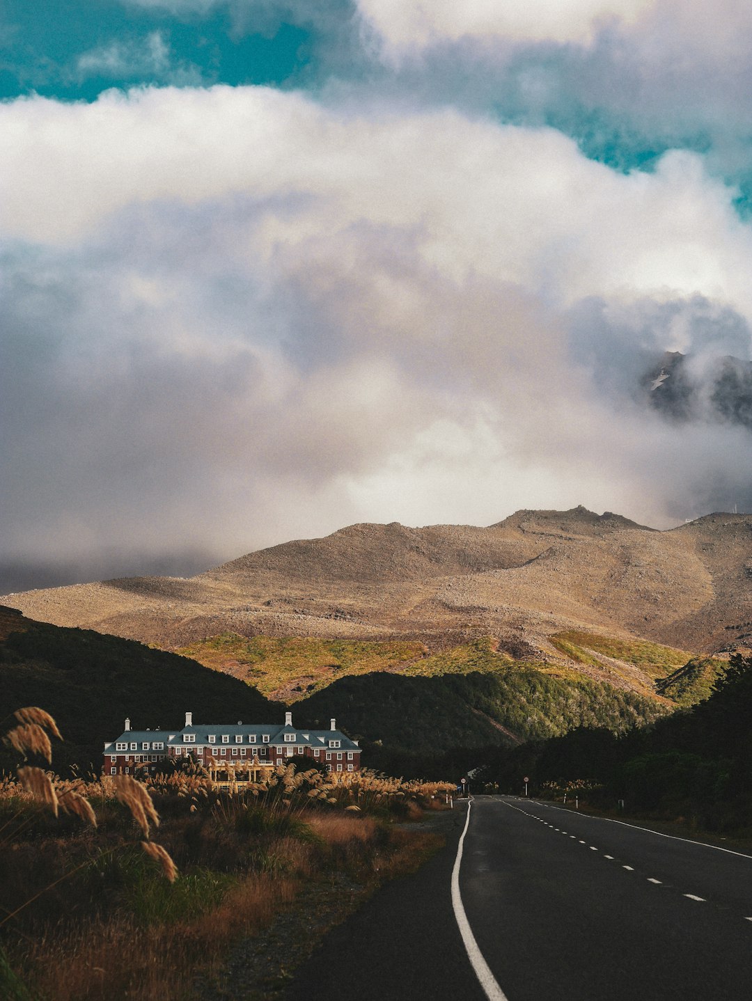 Best Internet Options for Travellers in New Zealand (2026) 14 empty grey concrete road stretching into the distance