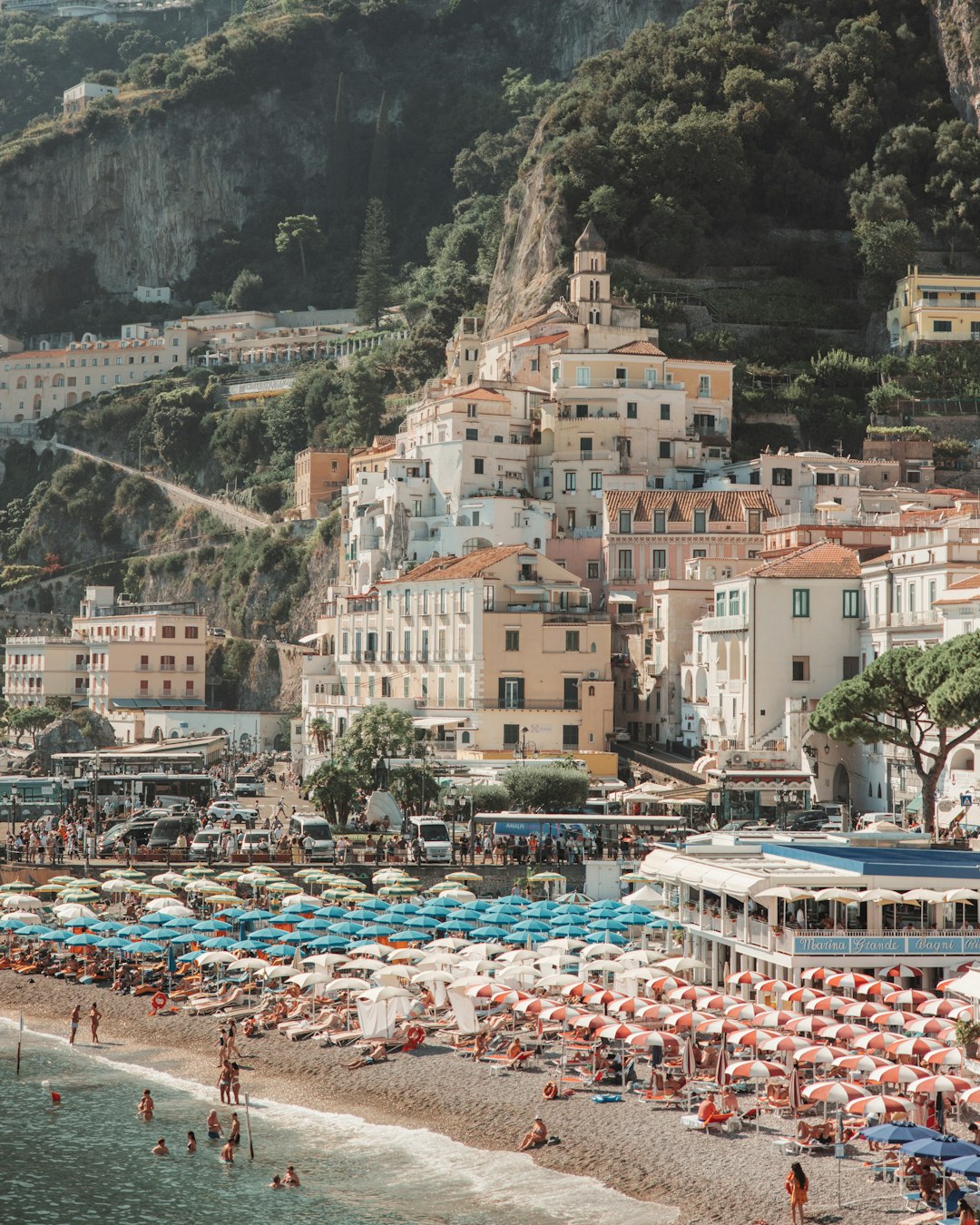 Beach town with colorful umbrellas on the Amalfi Coast