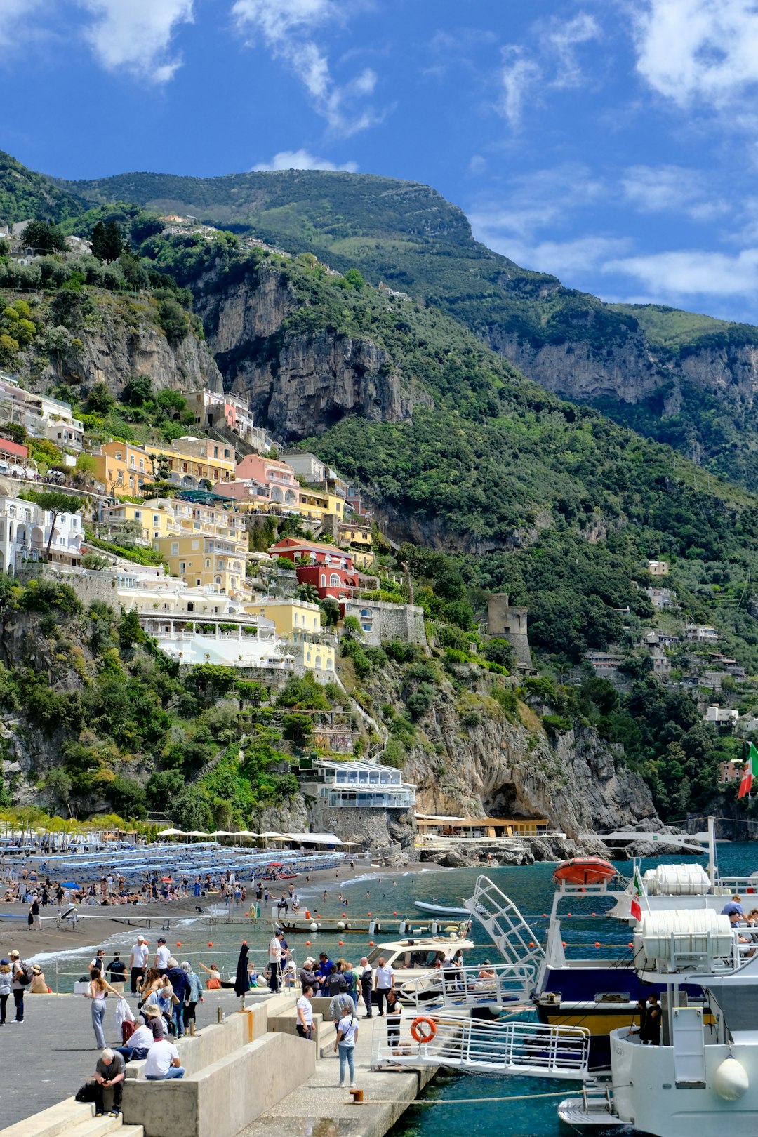 Colorful village on a steep hillside overlooking the sea