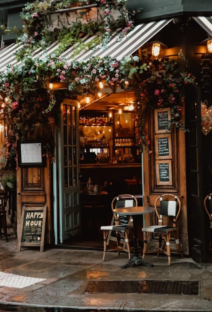 eSIM or Physical SIM in France? Pros, Cons & Best Pick for Travellers 2026 1 Charming Paris bistro entrance decorated with flowers and fairy lights